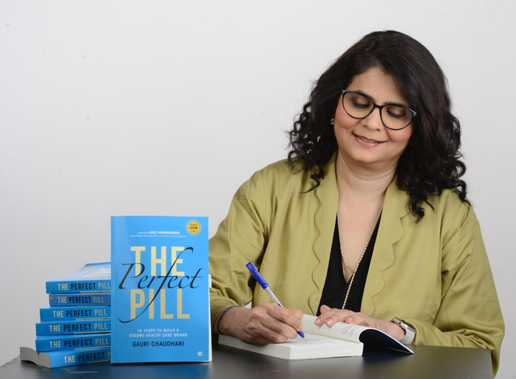 Gauri Chaudhari holding her book 'The Perfect Pill'