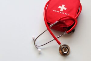 Image showing a person using a finger prick to collect a blood sample.